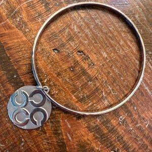 Coach Silver Bangle Bracelet with Circular Pendant
